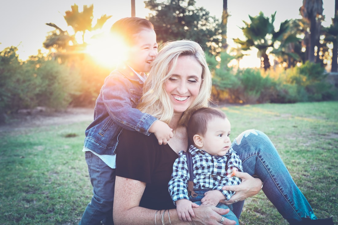 A mother laughing with her two sons