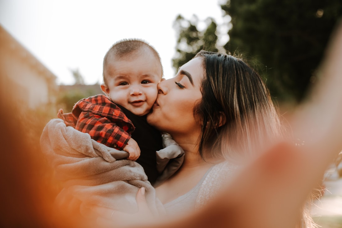 A mother holding her child close